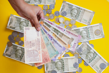 The brand new Indian currency bank notes of 50, 200, 500 and 2000 rupees. Success and got profit from business. GST tax on goods and service.