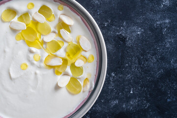 Spanish dish, cold soup ajo blanco or ajoblanco from garlic, almonds, white wine vinegar, olive oil and grapes
