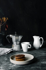 Hot espresso and milk on black table on focus and light in background