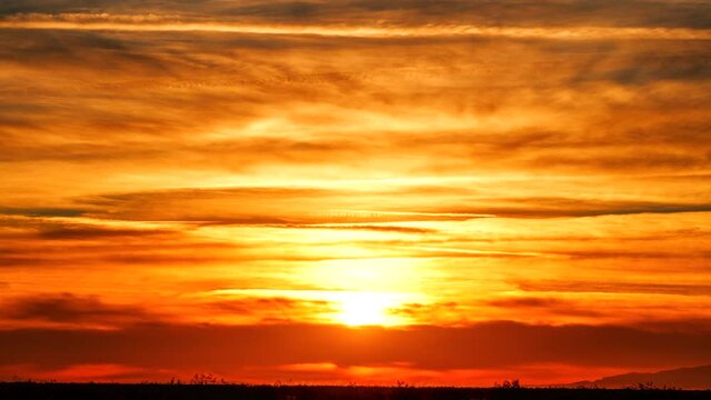 Brilliantly colorful "barn burner" sunset time lapse and cloudscape 