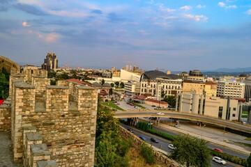 Naklejka na ściany i meble 09.08.2018. Skopje, Macedonia. City view from ancient ottoman castle, vardar river and vodno mountain during sunset.