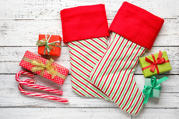 Obraz premium Composition with Christmas socks on white wooden background