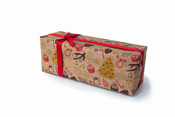 The  isolated gift with a shadow wrapped in craft paper with a pictures.
