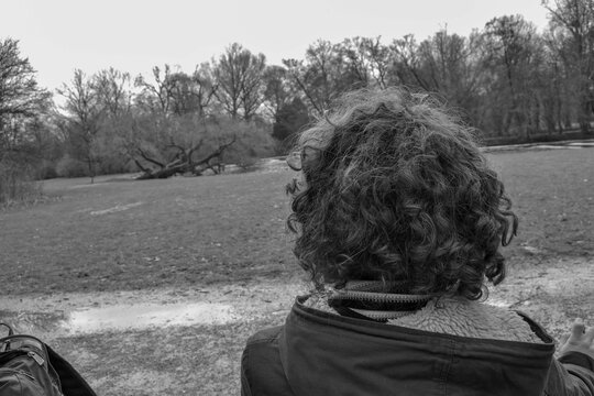 14.02.2012. Amsterdam. Netherland. A Alone Man Back Side, Who Is Looking For The Nature In Park Amsterdam. Black And White Photo.