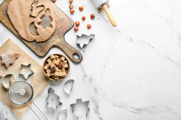 Composition with fresh dough for gingerbread cookies and cutters on white background