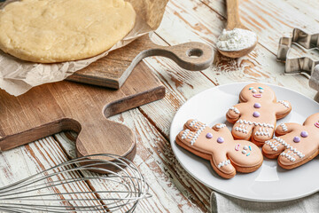 Gingerbread cookies with fresh dough on table