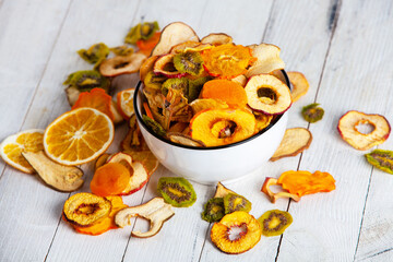 Organic Healthy Assorted Dried Fruit Mix close up. Dried fruit snacks. dried apples, mango, feijoa, dried apricots, prunes top view