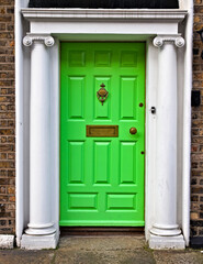 A typical green painted georgian wooden door in the Merrion Square neighborhood