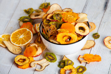 Organic Healthy Assorted Dried Fruit Mix close up. Dried fruit snacks. dried apples, mango, feijoa, dried apricots, prunes top view