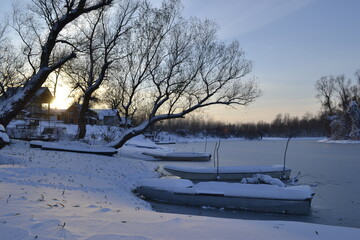 Panorama of the Danube tributary with winter cover in December. 