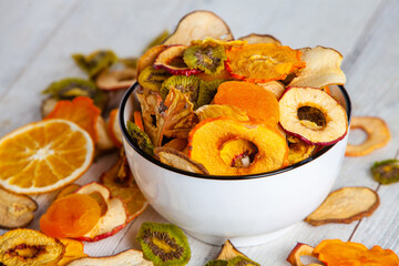 Organic Healthy Assorted Dried Fruit Mix close up. Dried fruit snacks. dried apples, mango, feijoa, dried apricots, prunes top view