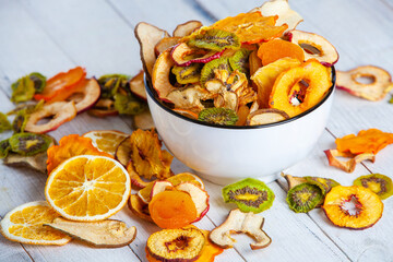 Organic Healthy Assorted Dried Fruit Mix close up. Dried fruit snacks. dried apples, mango, feijoa, dried apricots, prunes top view
