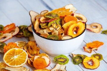 Organic Healthy Assorted Dried Fruit Mix close up. Dried fruit snacks. dried apples, mango, feijoa, dried apricots, prunes top view