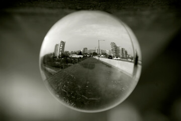 Street view through a lens ball.