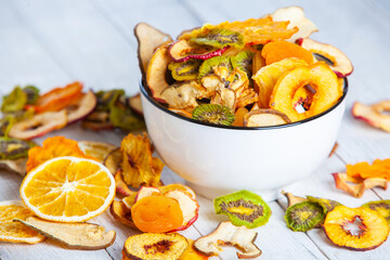 Organic Healthy Assorted Dried Fruit Mix close up. Dried fruit snacks. dried apples, mango, feijoa, dried apricots, prunes top view