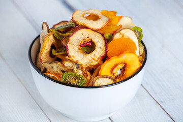 Organic Healthy Assorted Dried Fruit Mix close up. Dried fruit snacks. dried apples, mango, feijoa, dried apricots, prunes top view