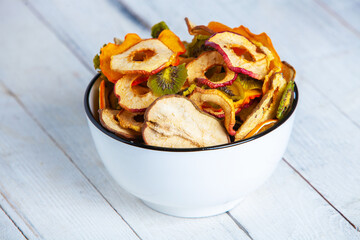 Organic Healthy Assorted Dried Fruit Mix close up. Dried fruit snacks. dried apples, mango, feijoa, dried apricots, prunes top view