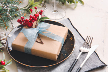 Fototapeta na wymiar Beautiful Christmas table setting with mistletoe on white background