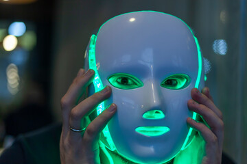 Artificial intelligence- A man with a mask on his face, half man half robot