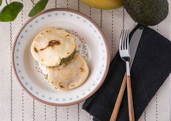 Venezuelan Arepas filled with cheese, banana and avocado.