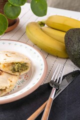 Venezuelan Arepas filled with cheese, banana and avocado.