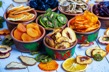 Organic Healthy Assorted Dried Fruit Mix close up. Dried fruit snacks. dried apples, mango, feijoa, dried apricots, prunes top view