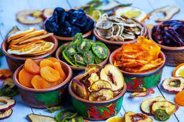 Organic Healthy Assorted Dried Fruit Mix close up. Dried fruit snacks. dried apples, mango, feijoa, dried apricots, prunes top view