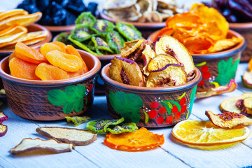 Organic Healthy Assorted Dried Fruit Mix close up. Dried fruit snacks. dried apples, mango, feijoa, dried apricots, prunes top view