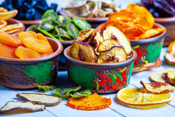 Organic Healthy Assorted Dried Fruit Mix close up. Dried fruit snacks. dried apples, mango, feijoa, dried apricots, prunes top view
