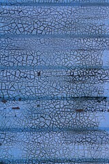 blue old broken wall of the facade, blue background