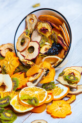Organic Healthy Assorted Dried Fruit Mix close up. Dried fruit snacks. dried apples, mango, feijoa, dried apricots, prunes top view