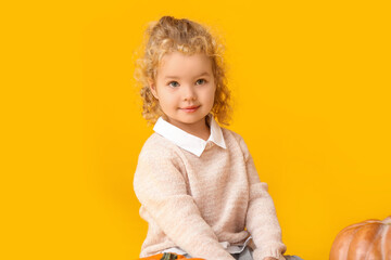 Cute little girl on color background