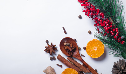 Set of aromatic spices and orange on a white background for mulled wine. Aromatic background and warming background. Flat lay. Place for text.