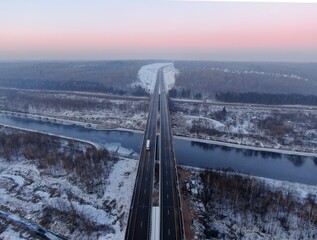 Aerial view of the Central Ring Road (CKAD) at sunrise. Beautiful panoramic landscape of a straight road overlooking the horizon. Travel by car in winter
