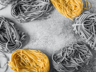 Grey and yellow fetuccini background.