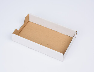 rectangular empty cardboard box of brown paper on a white background