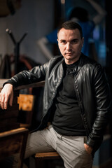 Portrait of a handsome young man. Shooting in a bar