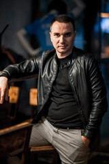 Portrait of a handsome young man. Shooting in a bar