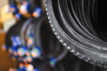 Fototapeta na wymiar Stocks of bicycle wire bead tires in the warehouse.