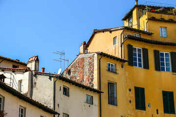 Fototapeta na wymiar Lucca, Italy. Beautiful architecture of famous square Piazza dell'Anfiteatro in Lucca.