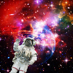 Astronaut and galaxy. The elements of this image furnished by NASA.