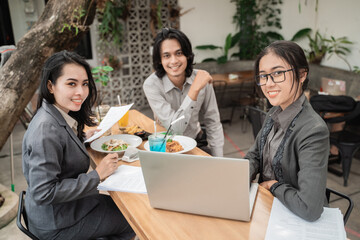 Portrait of young asian young business team meeting in a cafe