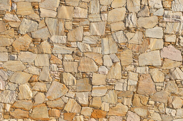 
beige stone wall perfectly fitted