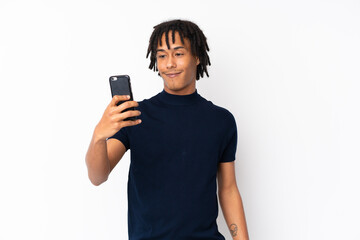 Young african american man isolated on white background making a selfie