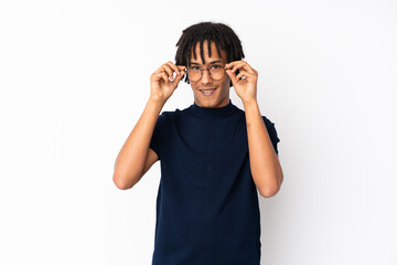 Young african american man isolated on white background with glasses and happy