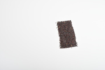 Mustard seeds shaped as rectangle on a plain white background.