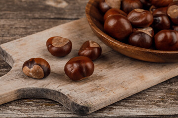 Chestnuts on an old wooden table