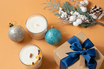 christmas decoration with candles, close-up, citrus, new year, christmas, gifts, pastel fresh colors, blue ribbon, gift box, Christmas tree toy.
