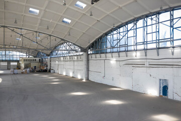 Huge industrial warehouse. Modern interior. Unique soviet architecture. Hemispherical reinforced concrete load bearing roof.