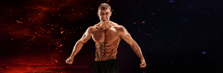Very brawny guy bodybuilder posing. Beautiful sporty guy male power. Fitness muscled man. Roar.